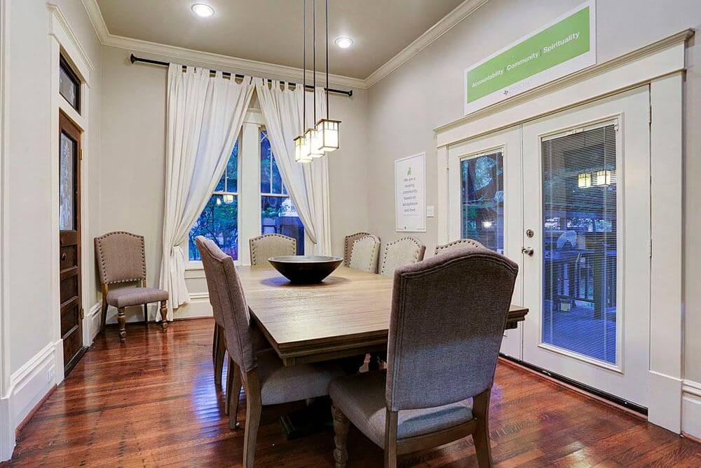 Dining room at Harvard House men’s supportive living in Houston Heights